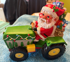 SANTA ON TRACTOR WITH PRESSIES