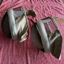 Vintage Leon Paul fencing masks with partial neck protection.