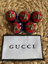 5 Gucci Bee Buttons and clothing tag