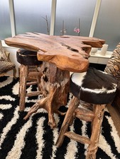 Solid Tree Table With Cowhide Stools Very Heavy and Is Lovely