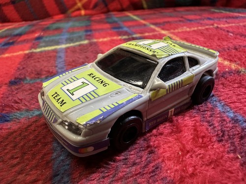 Micro slot racing - car,