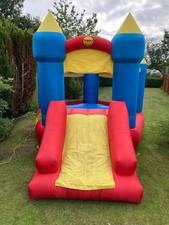 HAPPY HOP CHILDRENS BOUNCY CASTLE C/W BLOWER PEGS AND CARRYING BAG