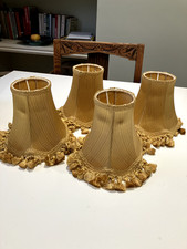 Vintage four small gold clip on tasselled lampshades