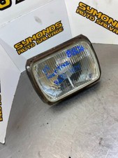 1997 DAIHATSU FOURTRAK DRIVERS SIDE OFF SIDE O/S HEADLIGHT REF: BB34