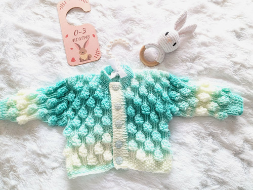 Hand knitted aqua multi - hand,