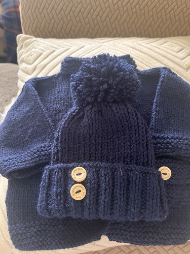 Hand knitted baby - hand,