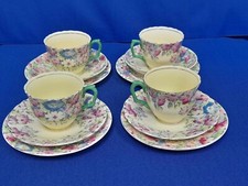 4 Crown Staffordshire cups, saucers and side plates