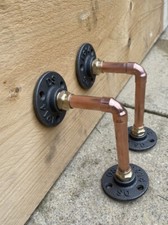 Pair copper pipe - of, shelf
