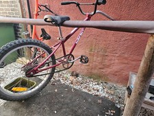 A red tagalong bike in good
