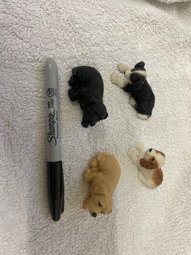 Three small dog figurines - three,