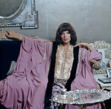 Joan Collins wearing the