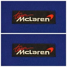 A Pair Of Motor Car Racing