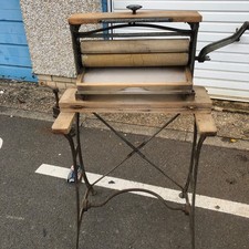  Old fashioned clothes mangle. It has age to it 