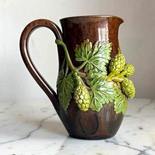 Rustic ware jug with green - ware’,
