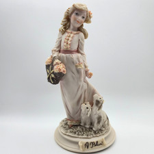 A Belcari Girl Figurine with