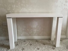 Elegant high gloss heavy duty console table with silver trimming on legs. 