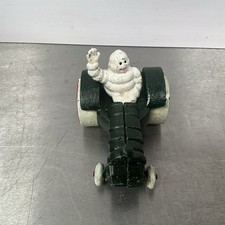 Michelin Man In Tractor Cast Iron