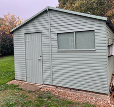 Large used heavy duty wooden garden / commercial wooden shed in good condition
