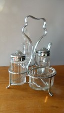Glass cruet set in a chrome