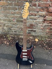 STRATOCASTER ELECTRIC GUITAR with FENDER SQUIER AMP.