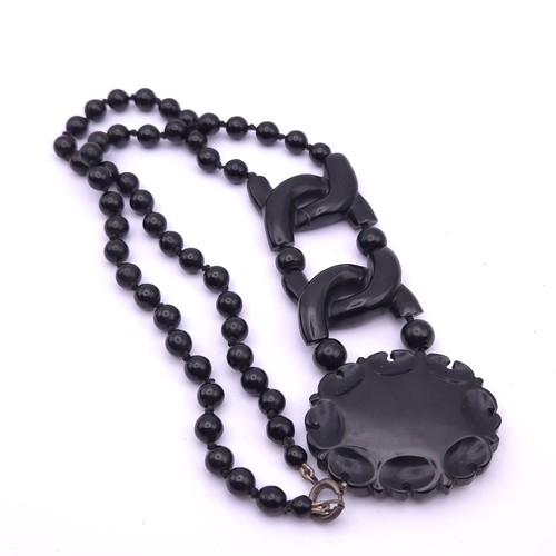 Carved whitby jet necklace - carved,