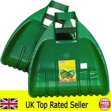 pair of leaf grabber hands leaf collector garden grass leaves waste scoop green