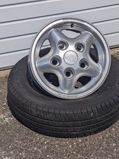 New, Old Stock, 5-Spoke Land Rover alloy wheel + free tyre 205/75 X 16. Pre-2016