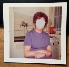 Woman in Kitchen with Sink