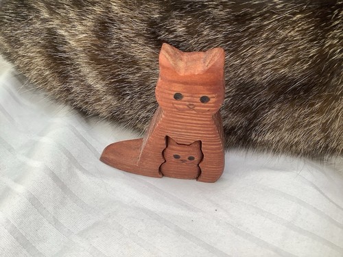 Hand carved wooden cat - hand,
