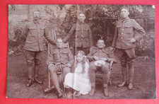 WW1 RPPC GROUP OF FIVE BRITISH SOLDIERS IN UNIFORM ON LEAVE ? WITH YOUNG GIRL