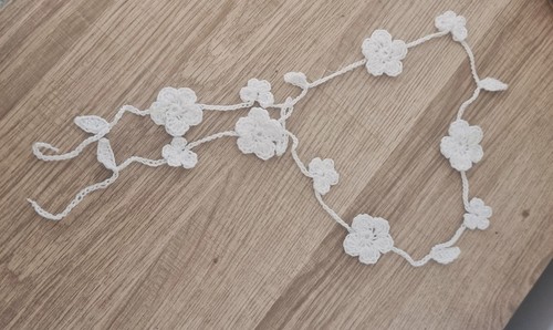 Hand crocheted white flower - hand,