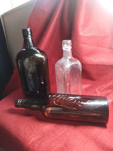 Three antique bottles a - three,