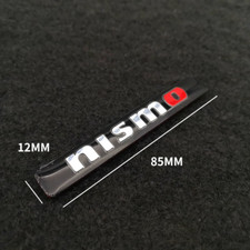 Black 84mm nismo badge - x,