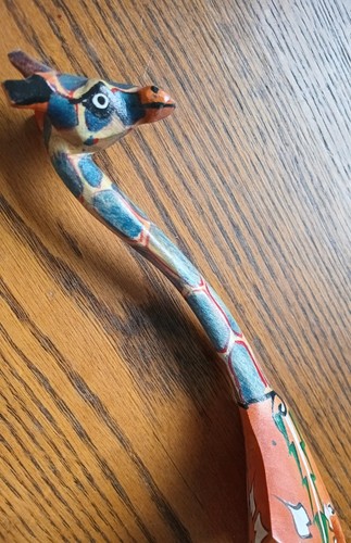 Hand carved wooden giraffe - hand,