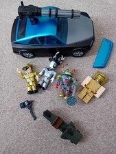 Roblox Jailbreak Car and four Figures.