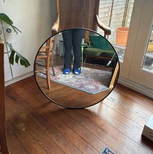 Black round wall mirror
