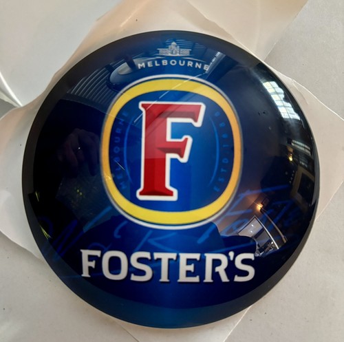 Fosters lager beer round - , fish