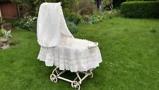 Vintage wicker cradle crib with drapes. White. French design.