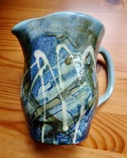 Unique pottery jug in green
