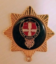 An old Girls Brigade badge pendant, enameled.