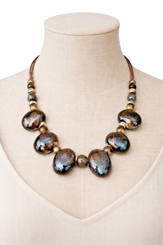 Chunky brown blue glass bead - &,
