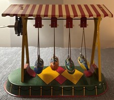 Vintage tin toy swinging boats