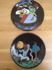 Pair of Turkish/Morroccan Plates decorated with Snake Charmer and Male Figures.
