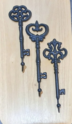 Key shaped coat - key, cast