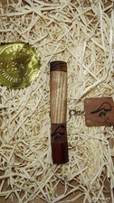 A unique pipe tobacco tamper -