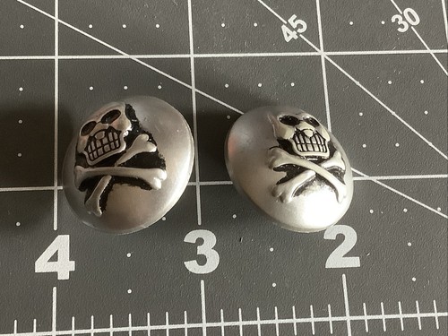 Skull and cross bones buttons - and,