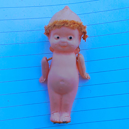Kewpie doll features - , a