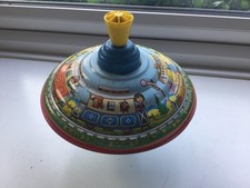 Rare vintage metal spinning top featuring trains.