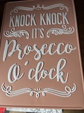 METAL SIGN HANGING,EMBOSSED LETTERING  "KNOCK KNOCK  ITS  PROSECCO O'CLOCK '