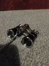 old syle binoculars black and silver 3x zoom opened but not used bag included.  